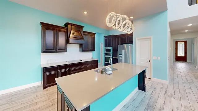 a kitchen with a table and chairs
