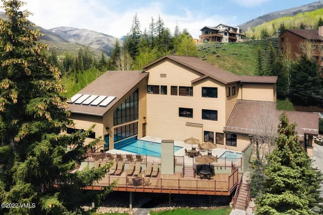 a aerial view of a house with a yard