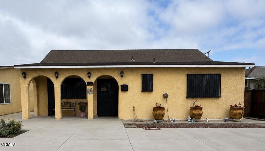 1214 South Ventura Road Oxnard, CA 93033 - Photo 2 of 7 a front view of a house with parking