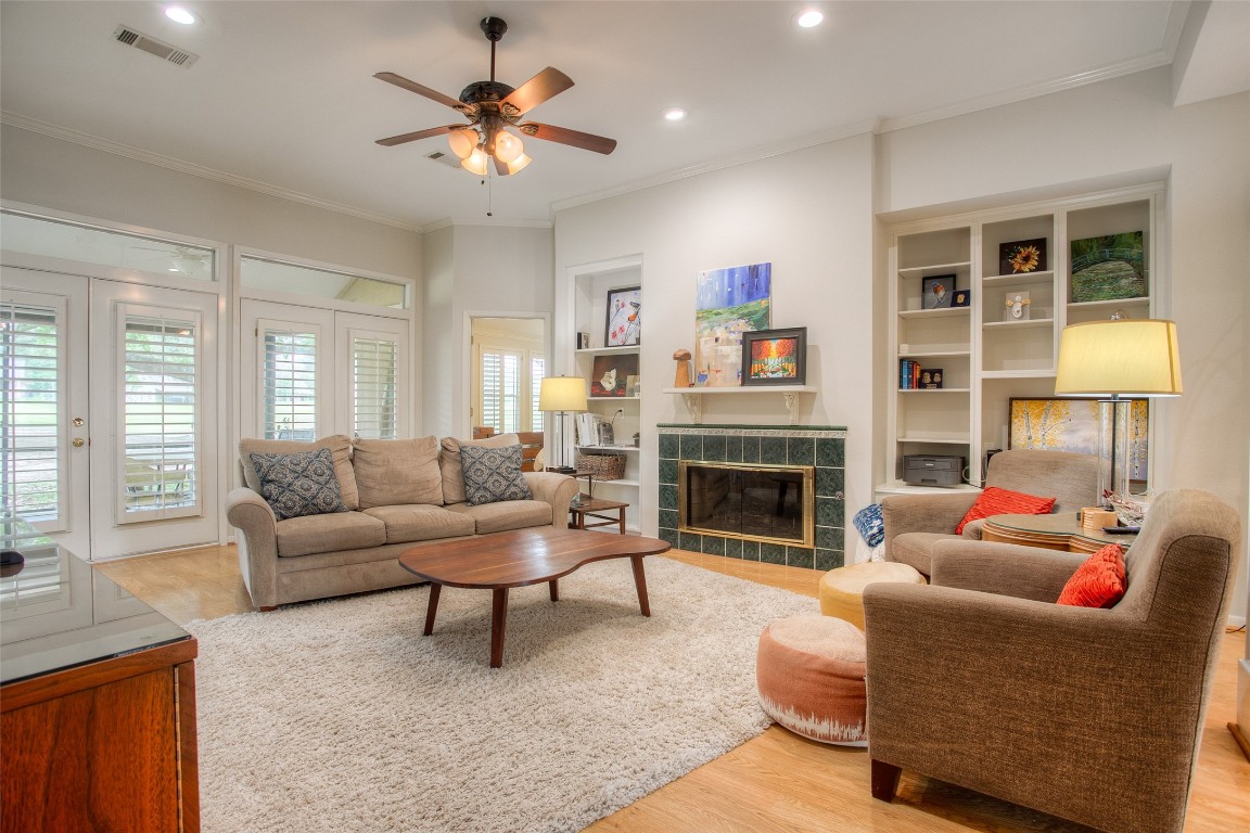 134 Waters Edge Huntsville, TX 77340 - Photo 17 of 38 a living room with furniture and a fireplace