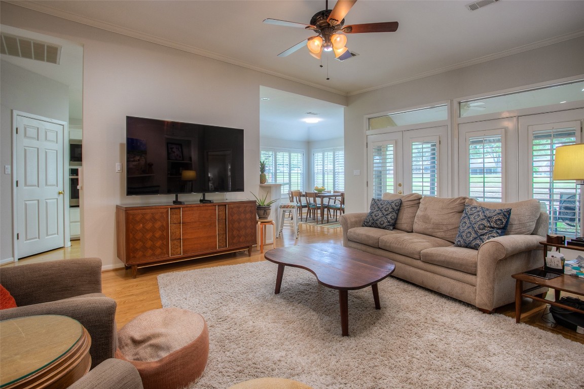 134 Waters Edge Huntsville, TX 77340 - Photo 20 of 38 a living room with furniture and a flat screen tv