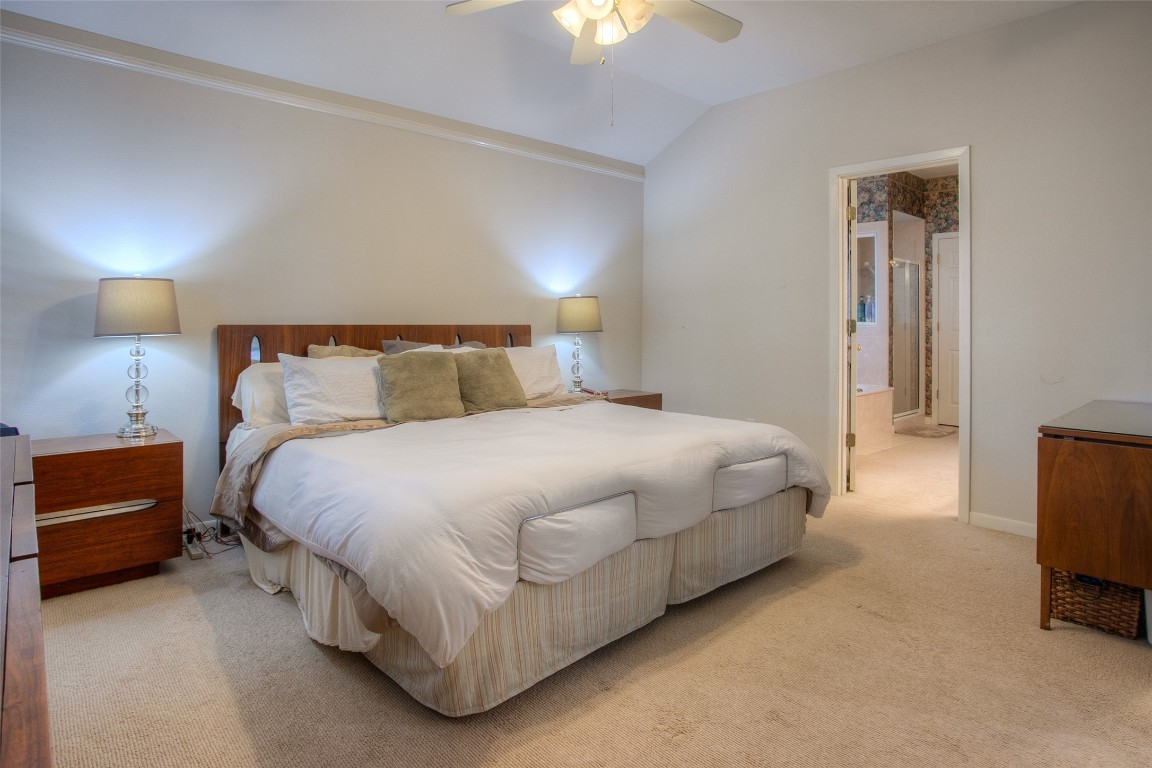 134 Waters Edge Huntsville, TX 77340 - Photo 26 of 38 a bedroom with a bed and a lamp