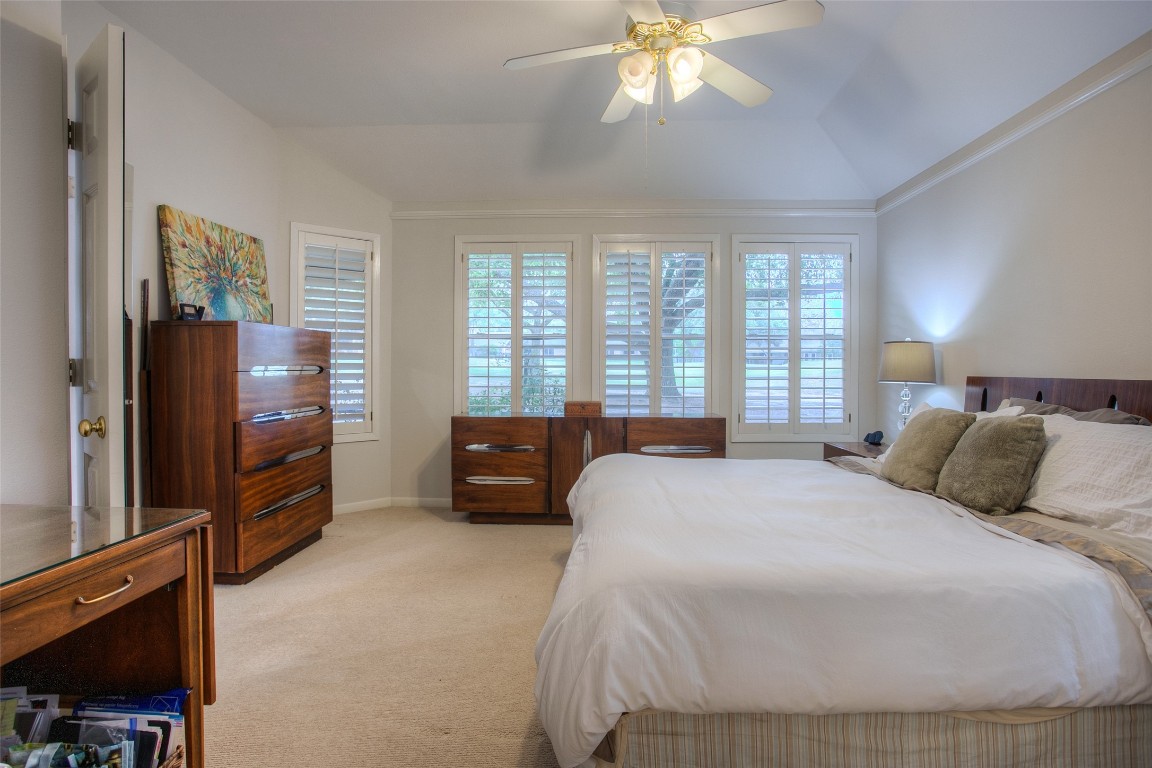 134 Waters Edge Huntsville, TX 77340 - Photo 28 of 38 a bedroom with a bed and a television
