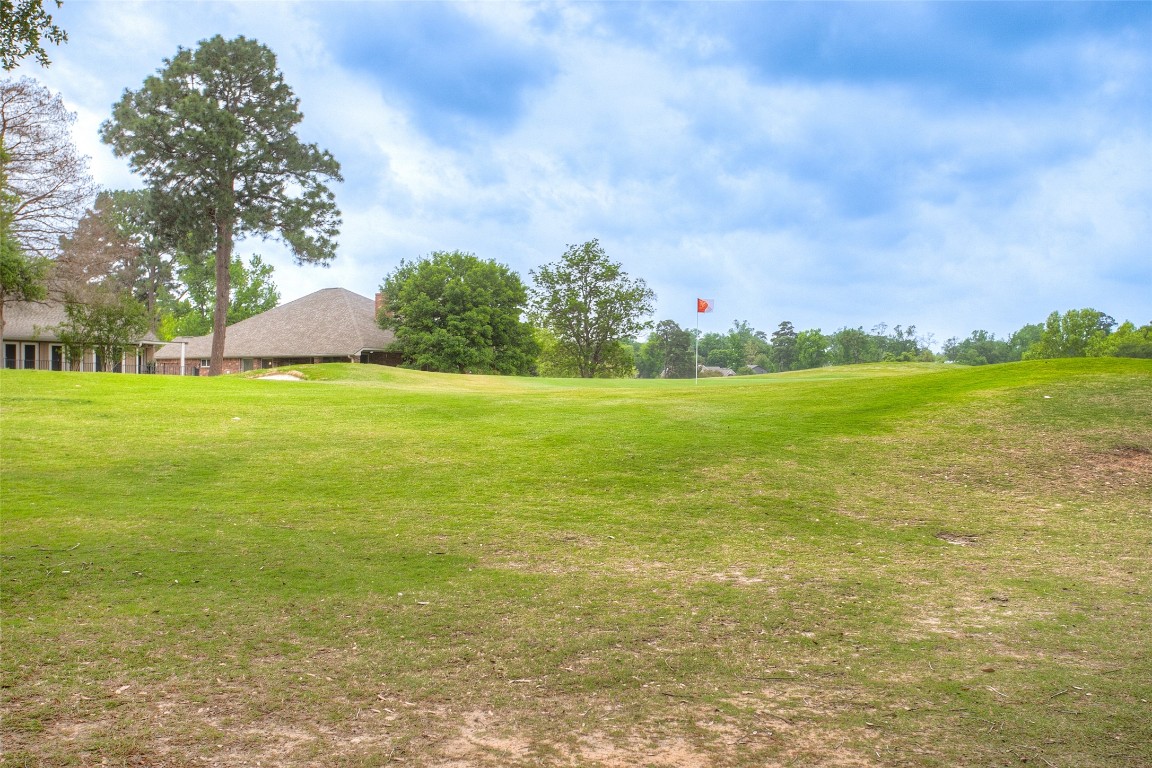 134 Waters Edge Huntsville, TX 77340 - Photo 4 of 38 a view of a big yard with an trees