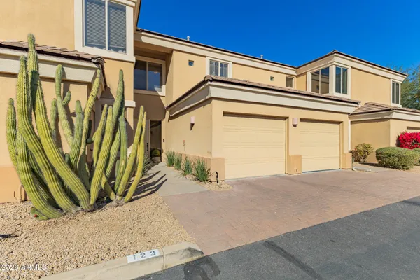 a front view of a house with a garage