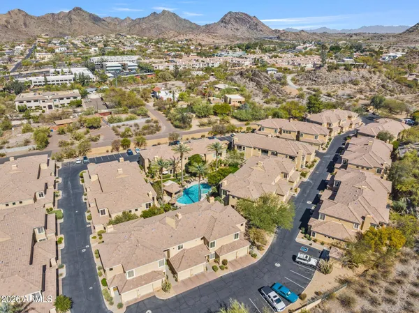 an aerial view of a house with a yard and garden