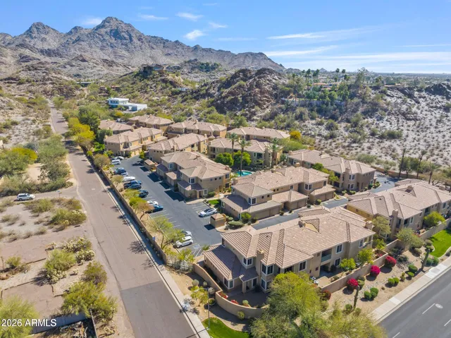 an aerial view of residential houses with outdoor space
