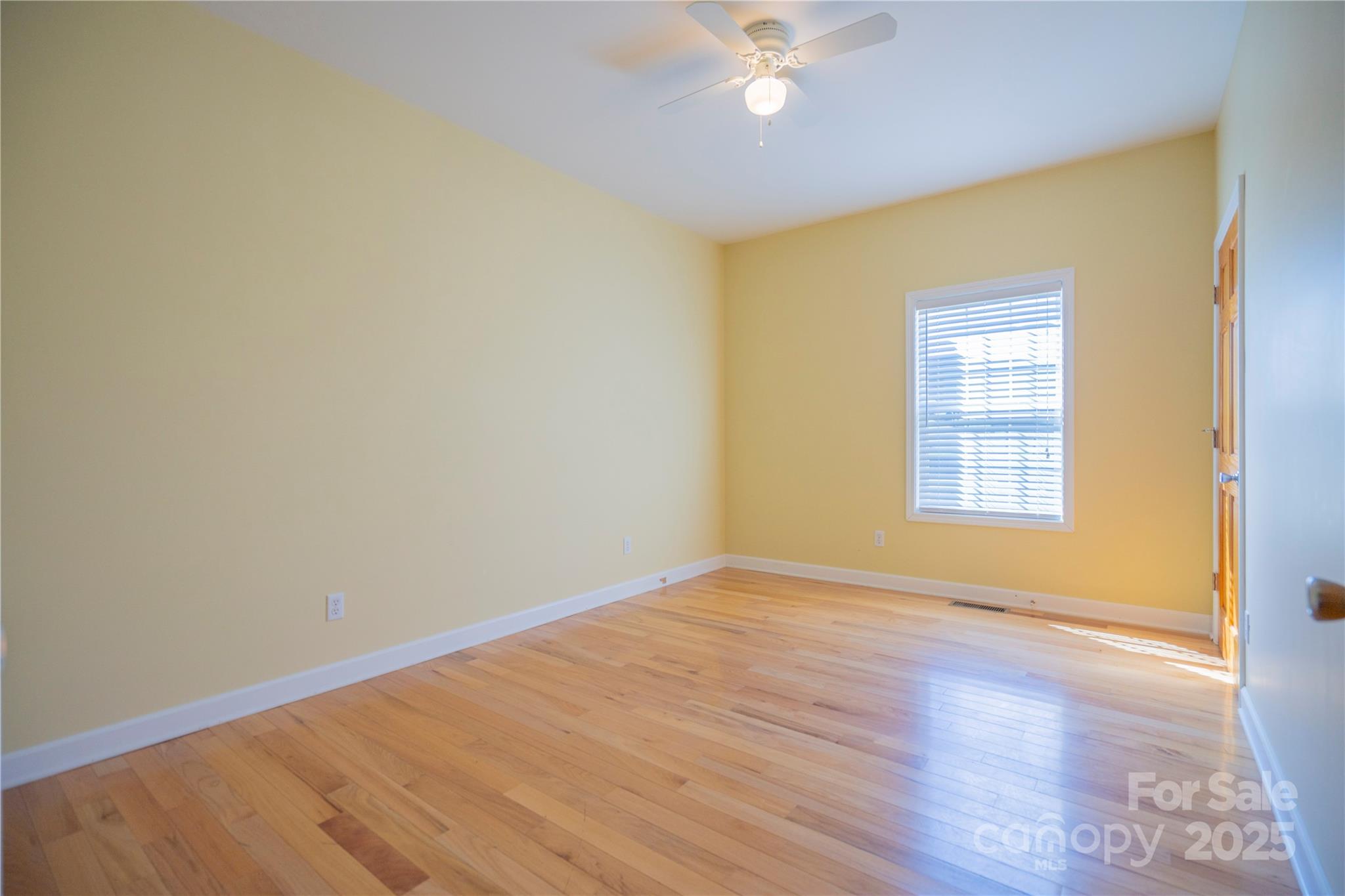 2536 Tyro Road Lexington, NC 27295 - Photo 13 of 31 a view of an empty room with wooden floor and a window