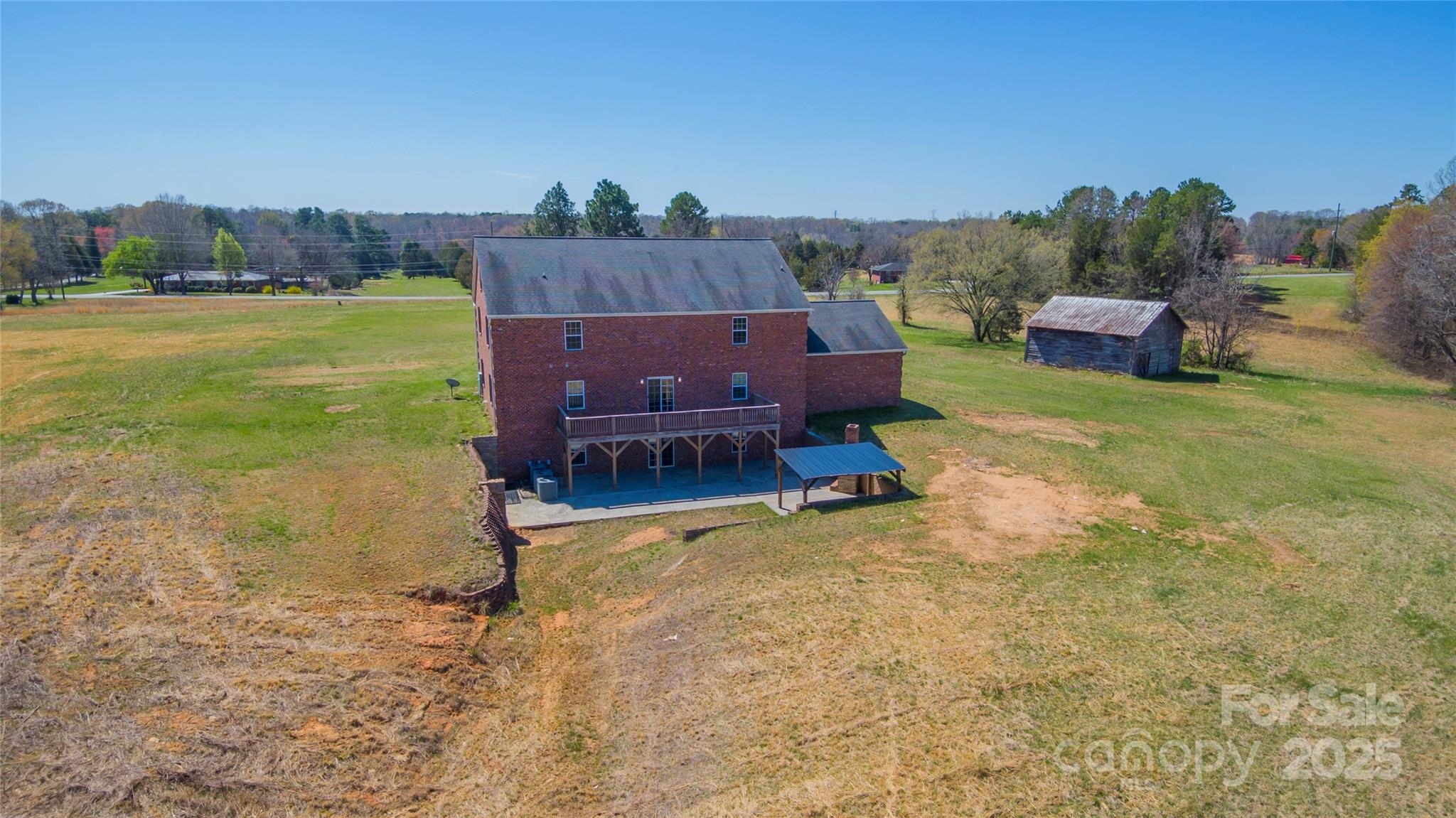 2536 Tyro Road Lexington, NC 27295 - Photo 4 of 31 a wooden bench sitting in the middle of a yard
