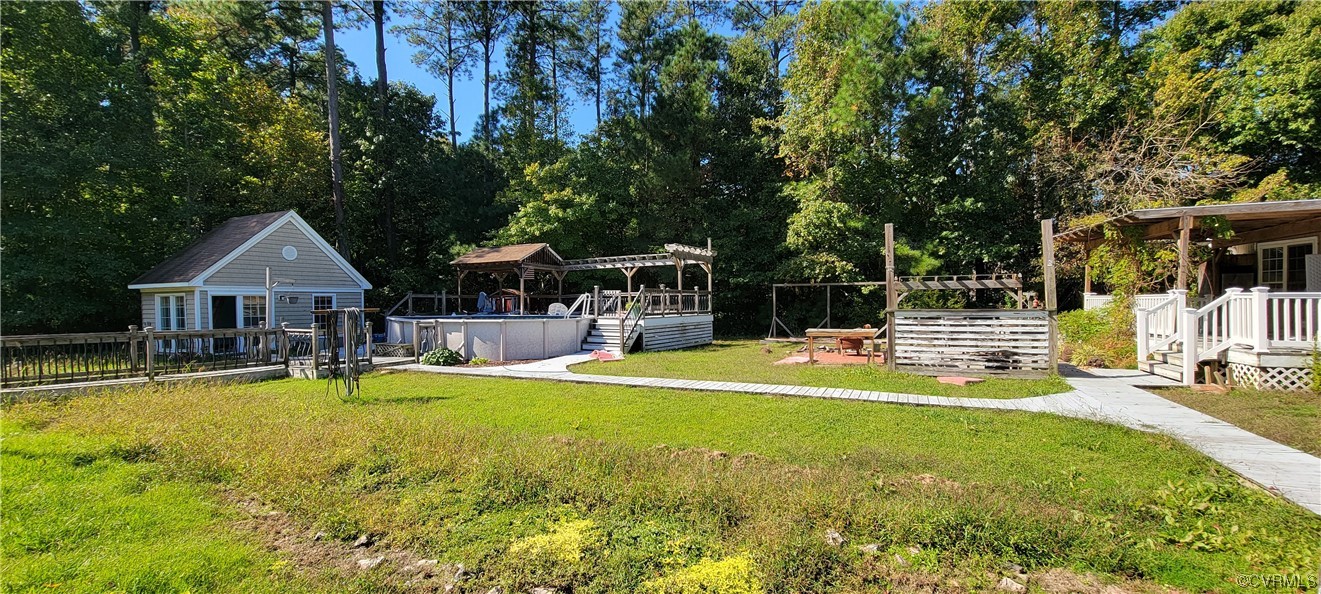 3502 Goodwin Neck Road Yorktown, VA 23692 - Photo 11 of 23 a view of a house with swimming pool and sitting area