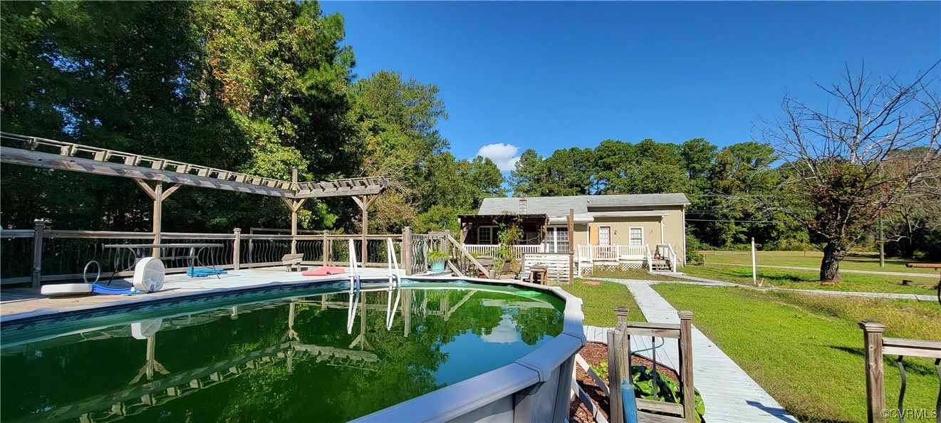 3502 Goodwin Neck Road Yorktown, VA 23692 - Photo 15 of 23 a view of a swimming pool with a patio and a yard