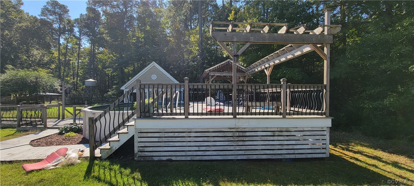 3502 Goodwin Neck Road Yorktown, VA 23692 - Photo 20 of 23 a view of a wooden deck with a bench