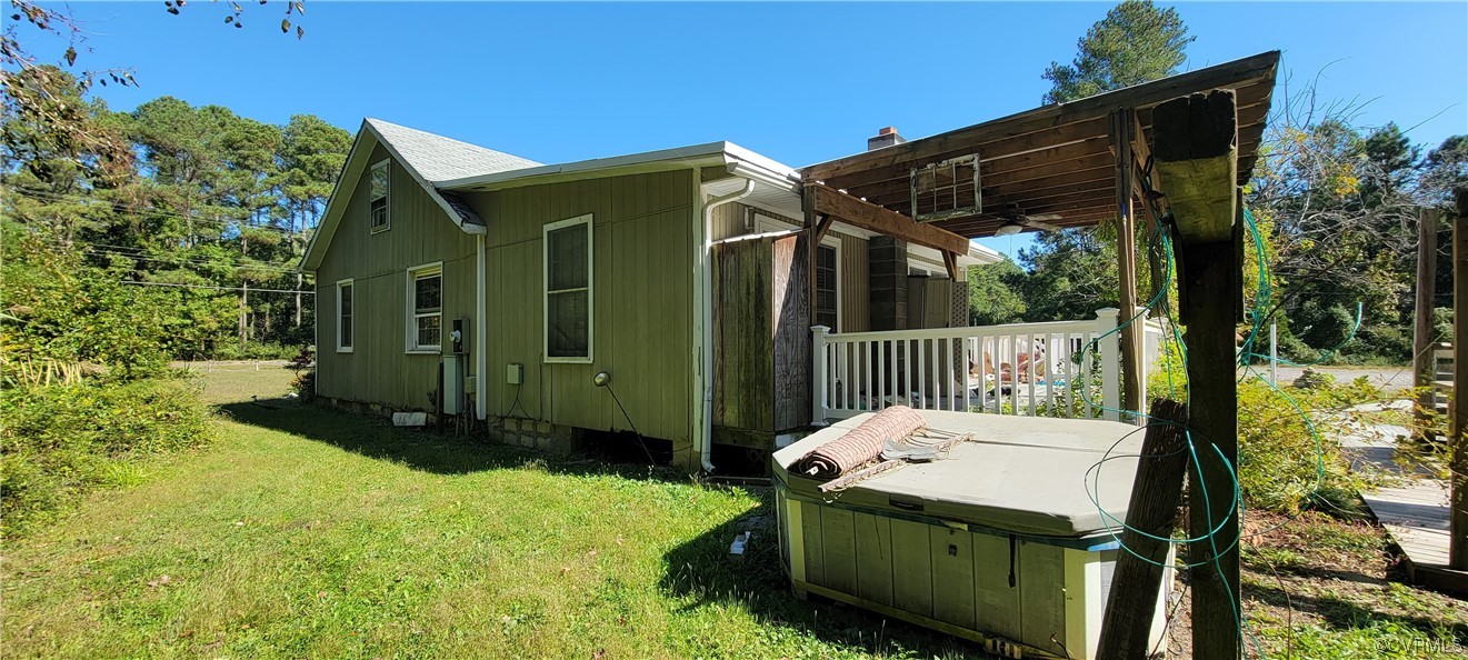 3502 Goodwin Neck Road Yorktown, VA 23692 - Photo 21 of 23 a backyard of a house with yard table and chairs