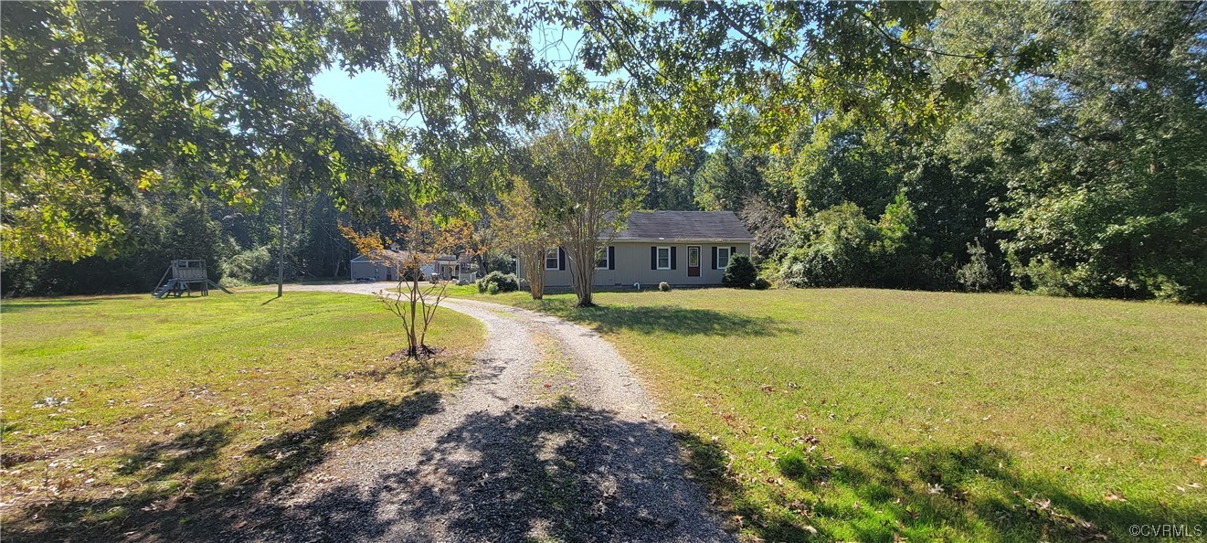 3502 Goodwin Neck Road Yorktown, VA 23692 - Photo 22 of 23 a swimming pool with trees in the background