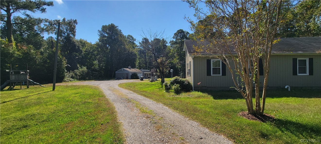 3502 Goodwin Neck Road Yorktown, VA 23692 - Photo 23 of 23 a view of a house with backyard and a tree