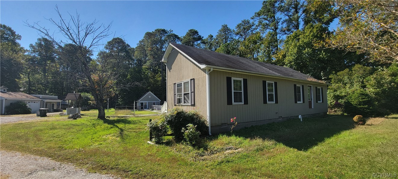 3502 Goodwin Neck Road Yorktown, VA 23692 - Photo 8 of 23 a backyard of a house with yard and outdoor seating