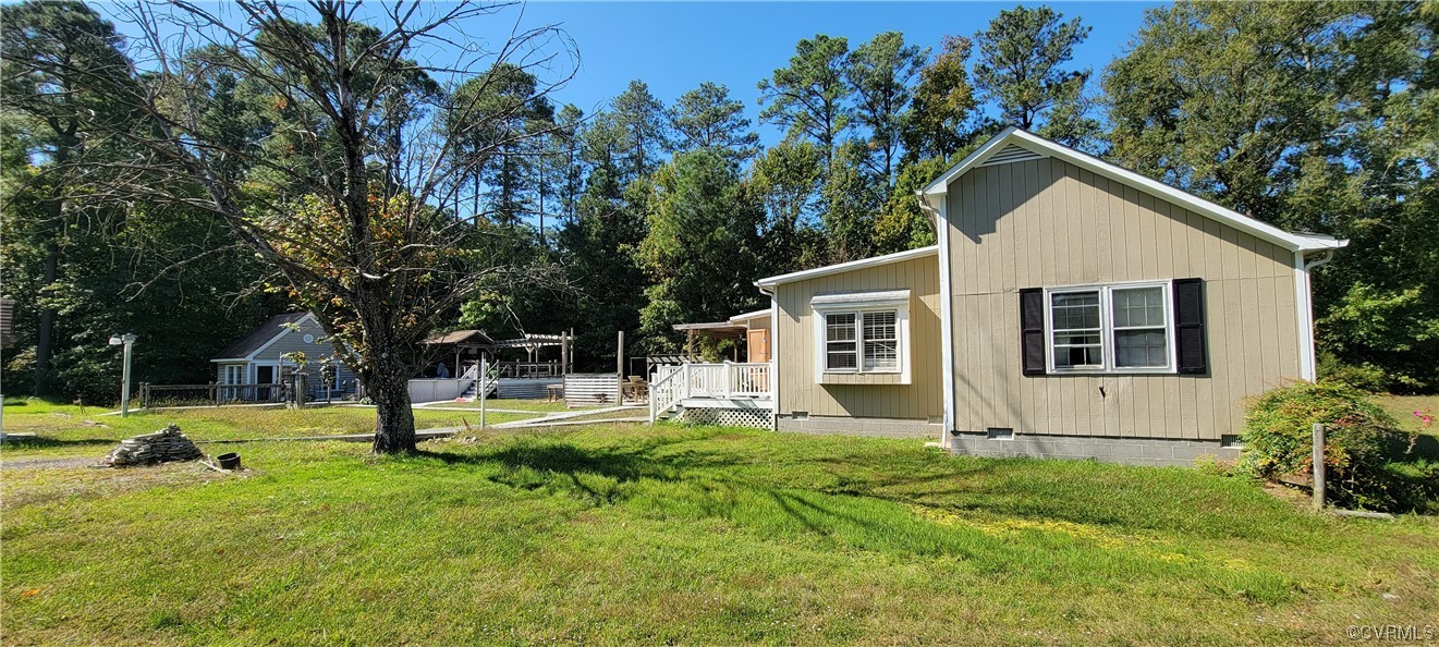 3502 Goodwin Neck Road Yorktown, VA 23692 - Photo 9 of 23 a view of a house with backyard and trees