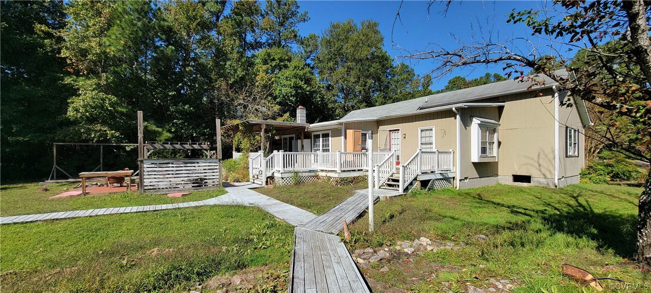 3502 Goodwin Neck Road Yorktown, VA 23692 - Photo 10 of 23 a view of a house with backyard and sitting area