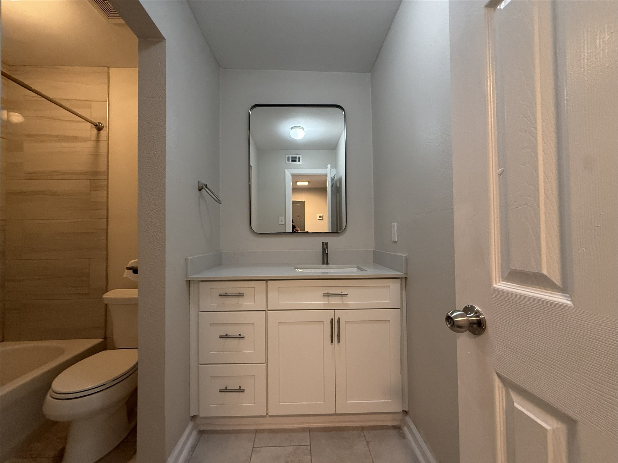 1824 Thonig Road, Unit 10 Houston, TX 77055 - Photo 14 of 17 a bathroom with a toilet sink and mirror