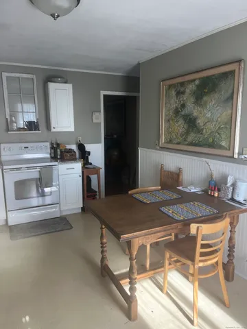 a dining room with a stove and a table