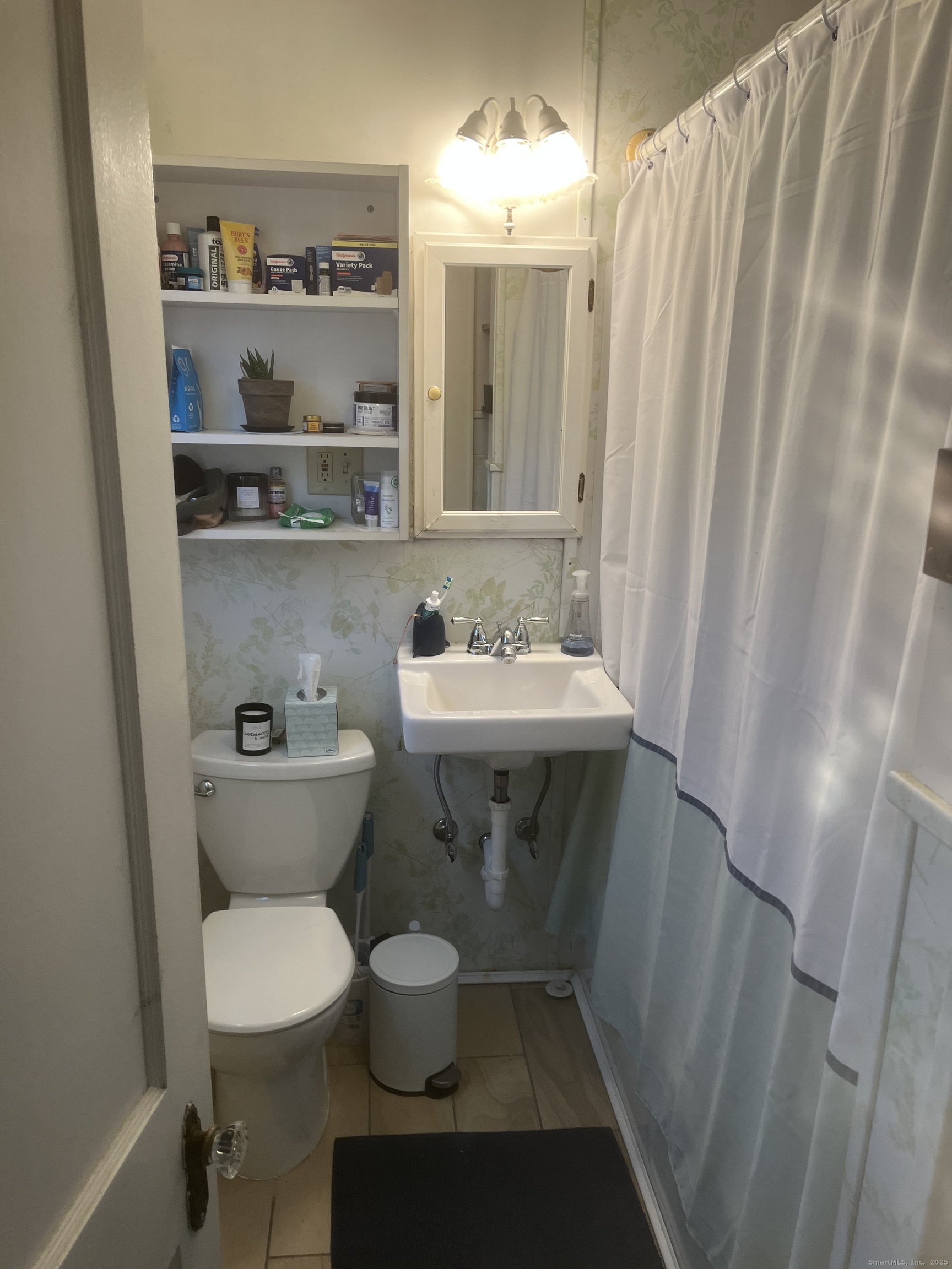 83 Ledyard Avenue Groton, CT 06340 - Photo 7 of 15 a bathroom with a sink and a mirror