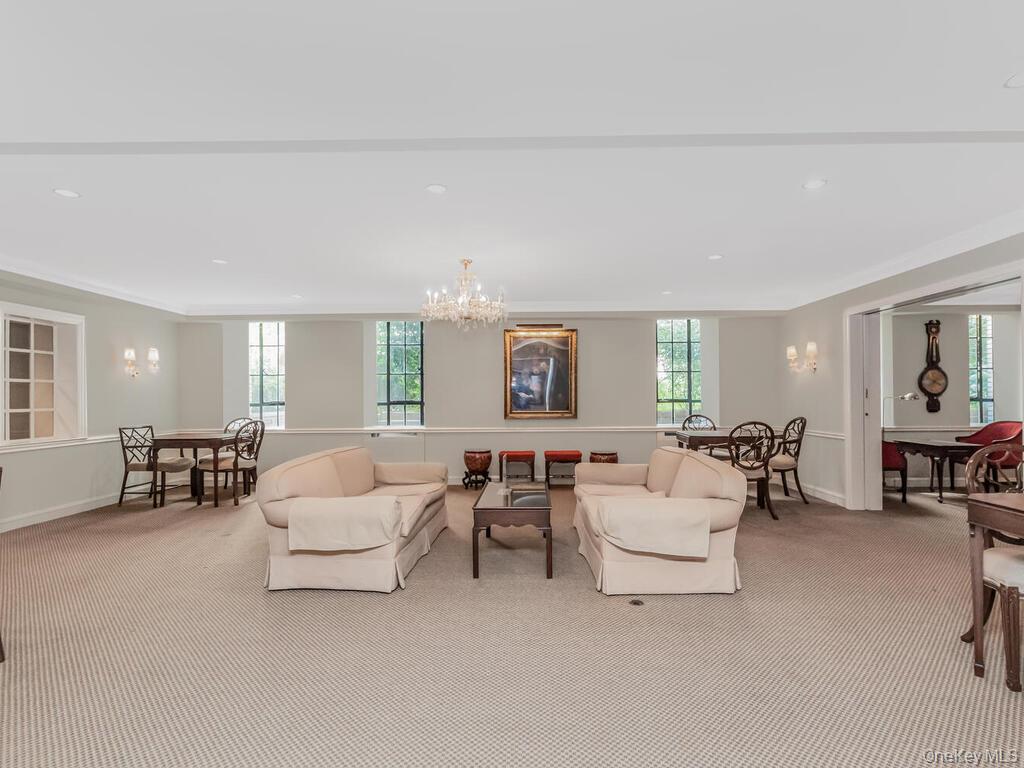 340 West 57th Street, Unit 5F Manhattan, NY 10019 - Photo 21 of 24 a living room with furniture and a large window