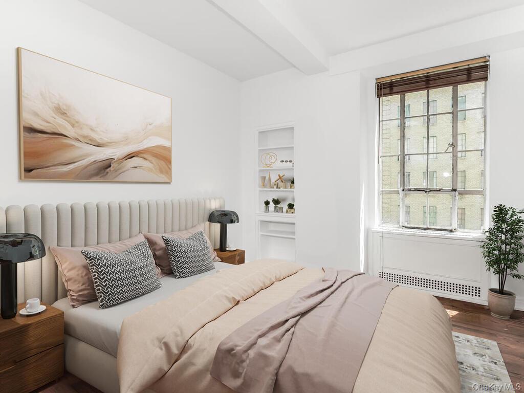 340 West 57th Street, Unit 5F Manhattan, NY 10019 - Photo 10 of 24 a bedroom with a bed and a window