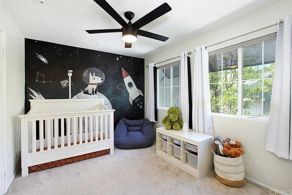 52 Palladium Lane, Unit 82 Ladera Ranch, CA 92694 - Photo 10 of 20 a bedroom with furniture and a window