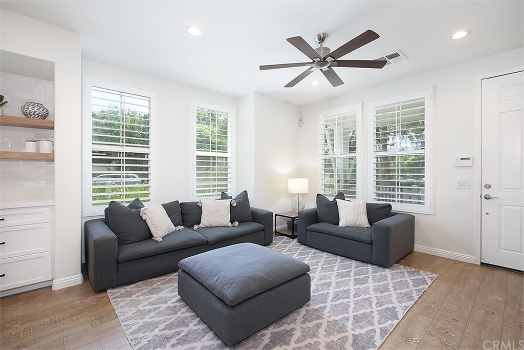 52 Palladium Lane, Unit 82 Ladera Ranch, CA 92694 - Photo 5 of 20 a living room with furniture and windows