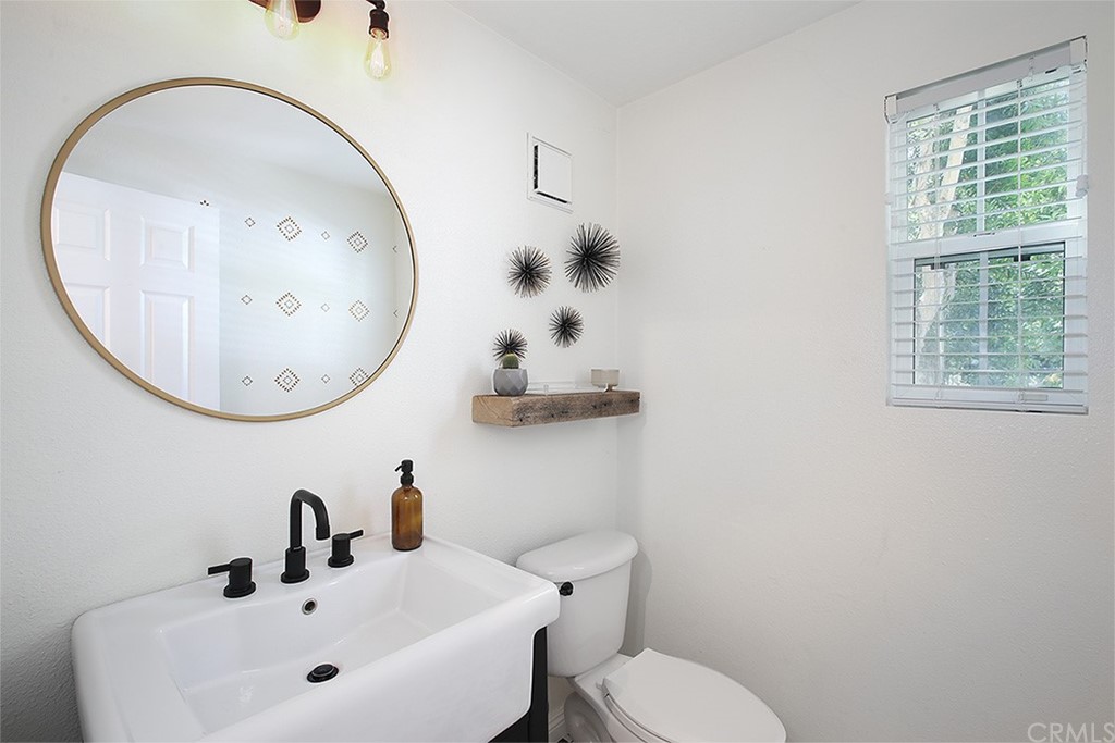 52 Palladium Lane, Unit 82 Ladera Ranch, CA 92694 - Photo 6 of 20 a bathroom with a sink mirror and toilet