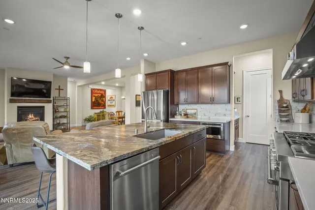 a view of a chairs and table in the balcony