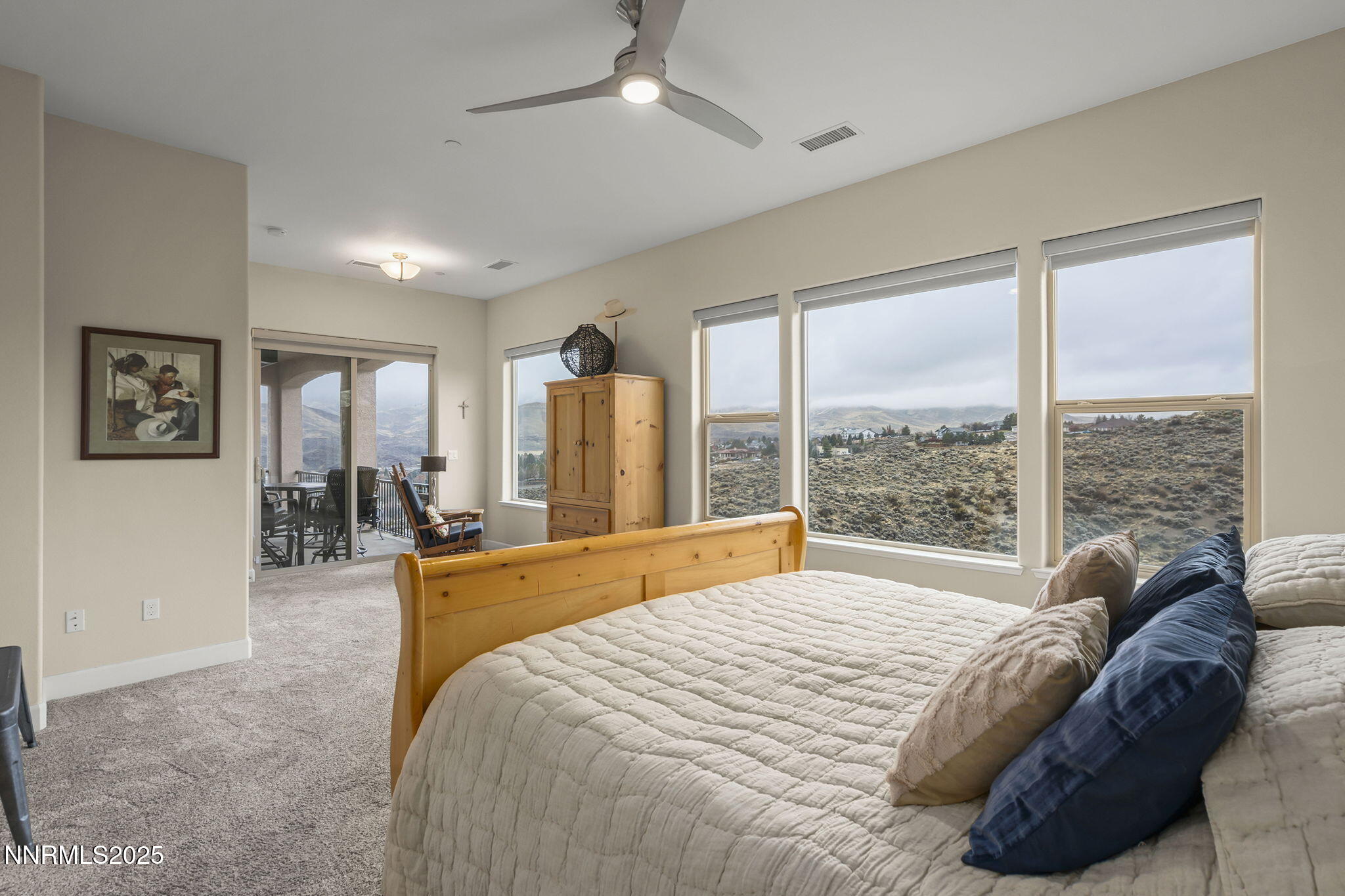 540 Gooseberry Drive Reno, NV 89523 - Photo 21 of 48 a spacious bedroom with a large bed and a large window