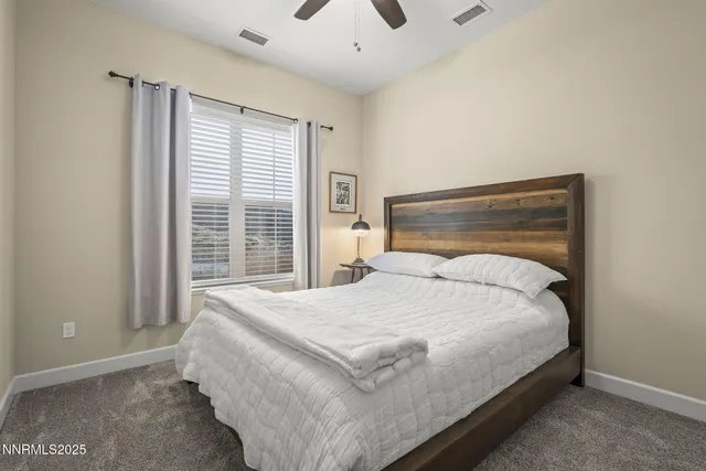 a bathroom with a sink toilet vanity and shower