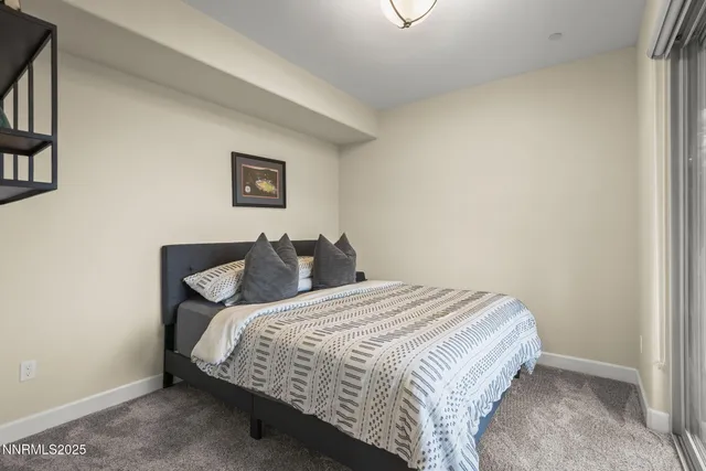 a view of a patio with a table chairs and a backyard