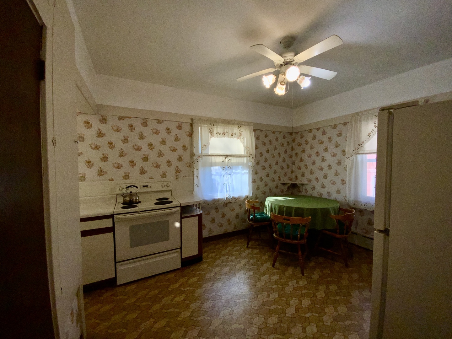 403 Rhodes Avenue Big Rock, IL 60511 - Photo 7 of 48 a kitchen with a stove and a microwave