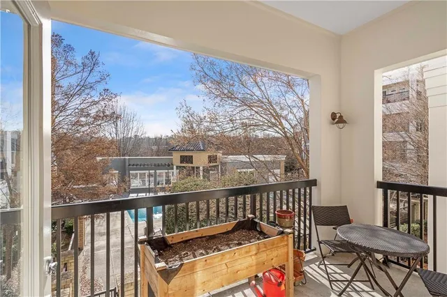 a view of a balcony with furniture