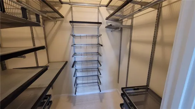 a view of entryway with wooden floor and stairs