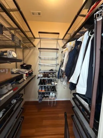 a view of a gym with wooden floor