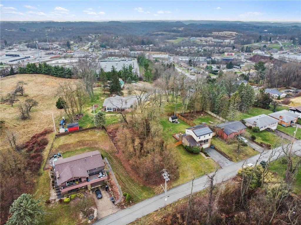 1810 Naser Road North Versailles, PA 15137 - Photo 4 of 14 an aerial view of residential houses with outdoor space