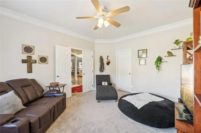 a view of walk in closet with clothes