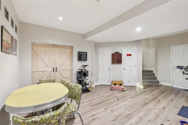 a view of a swimming pool with a yard and seating area