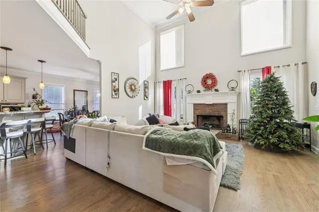 a living room with furniture and flowers