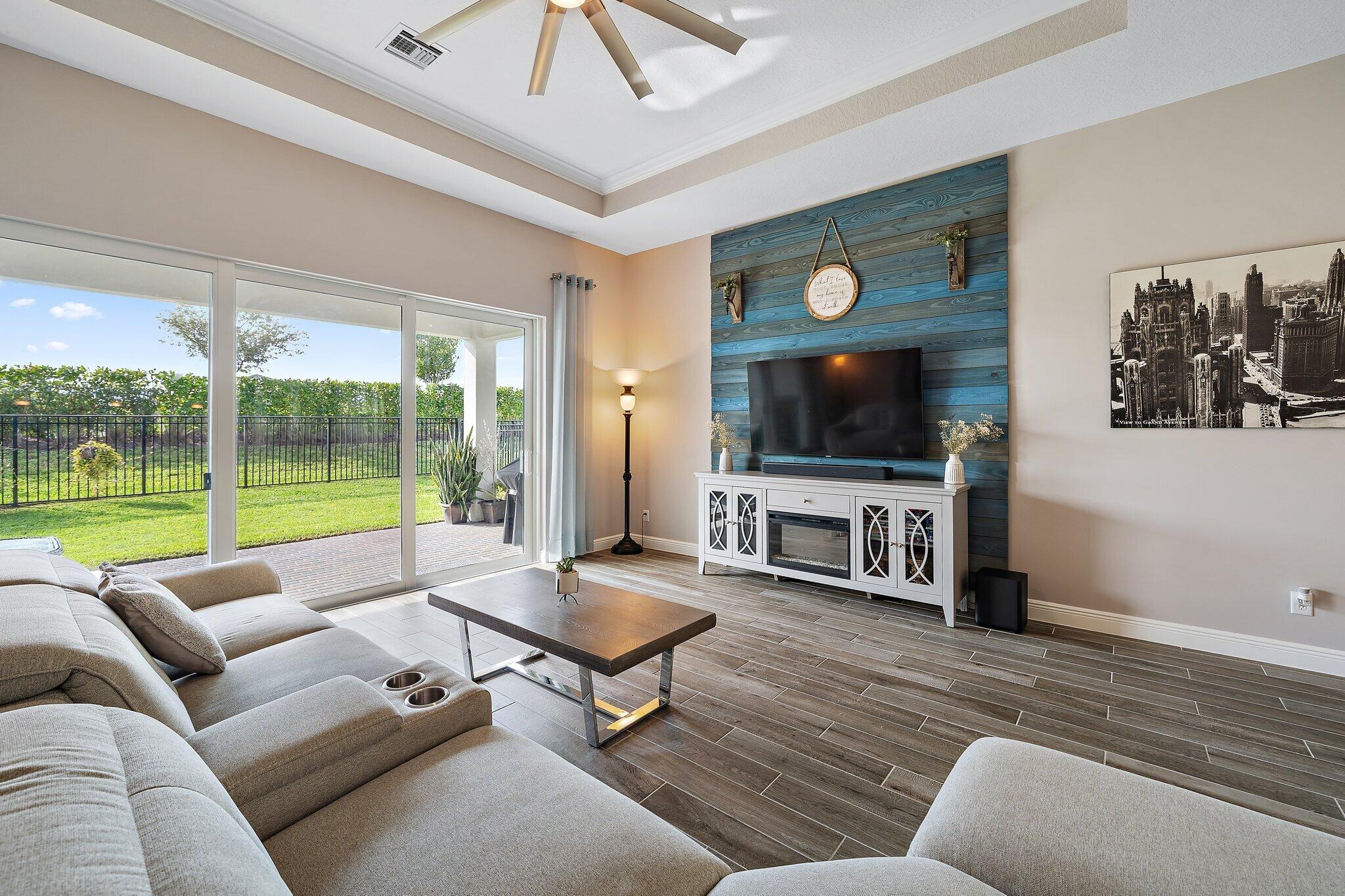 19540 Wheelbarrow Bend Loxahatchee, FL 33470 - Photo 15 of 54 a living room with furniture and a flat screen tv