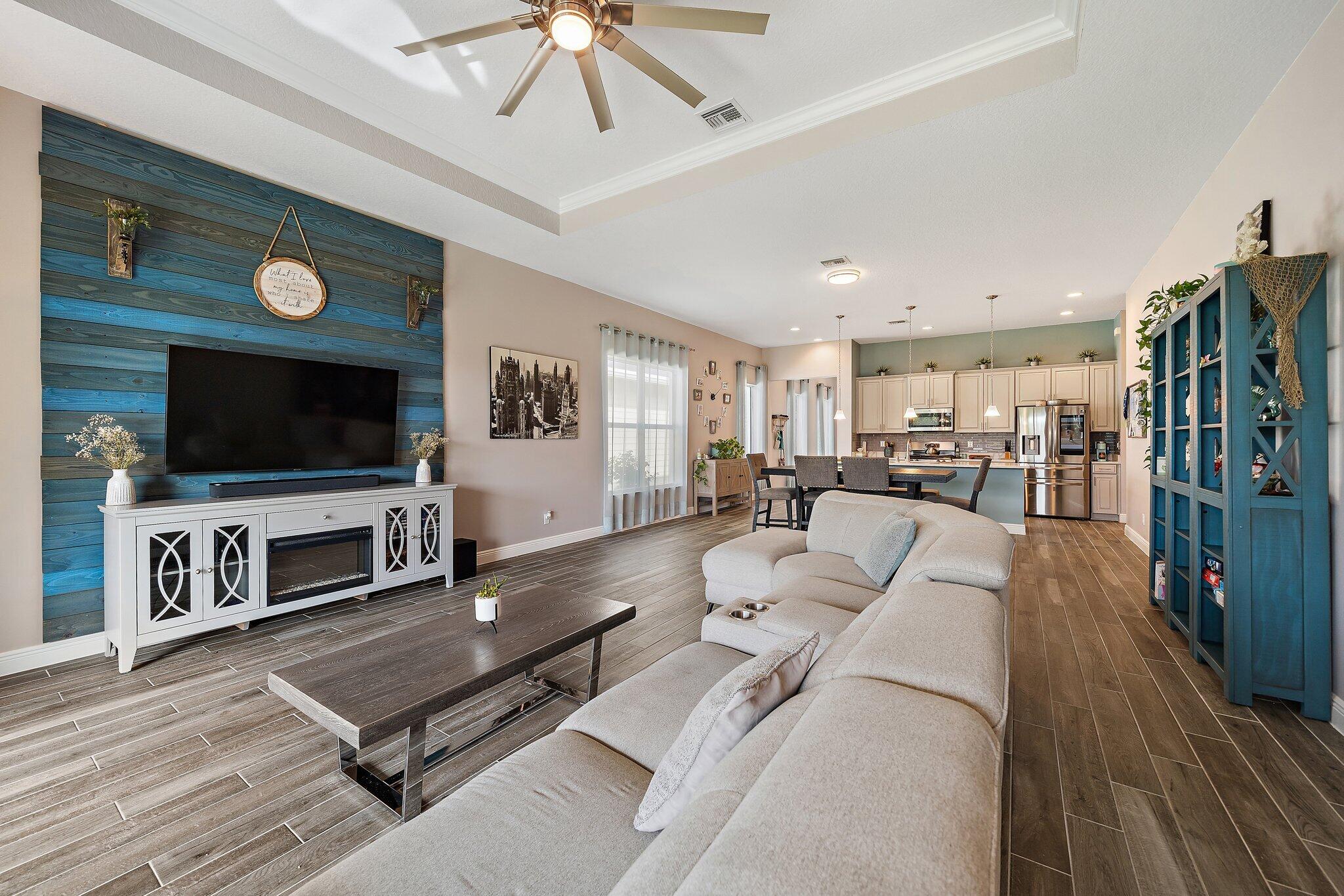 19540 Wheelbarrow Bend Loxahatchee, FL 33470 - Photo 16 of 54 a living room with furniture and a flat screen tv