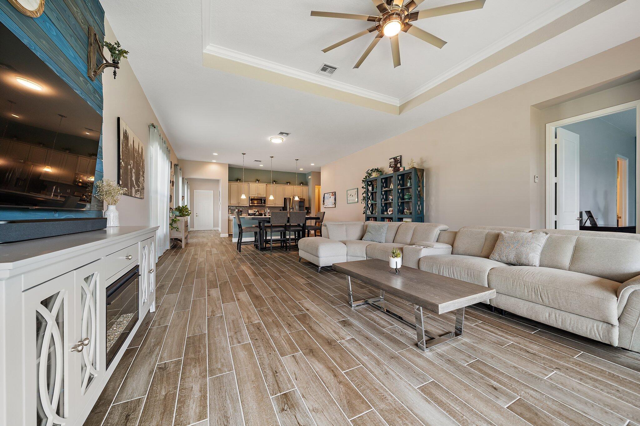 19540 Wheelbarrow Bend Loxahatchee, FL 33470 - Photo 18 of 54 a living room with furniture and a flat screen tv
