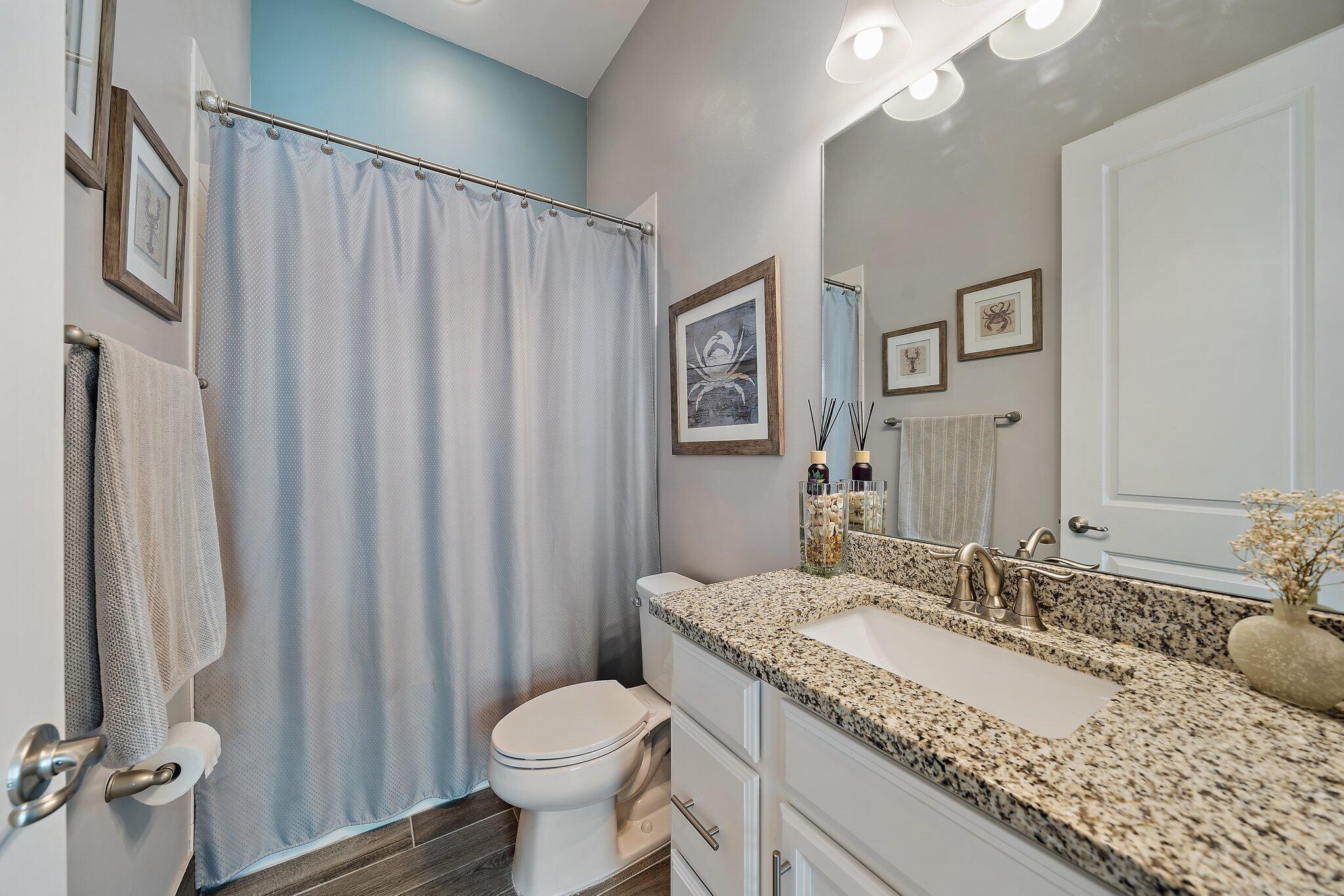 19540 Wheelbarrow Bend Loxahatchee, FL 33470 - Photo 20 of 54 a bathroom with a granite countertop sink and a mirror