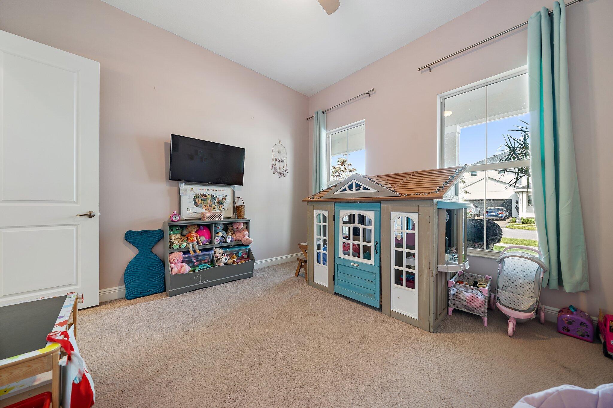 19540 Wheelbarrow Bend Loxahatchee, FL 33470 - Photo 22 of 54 a view of a livingroom with furniture and a flat screen tv