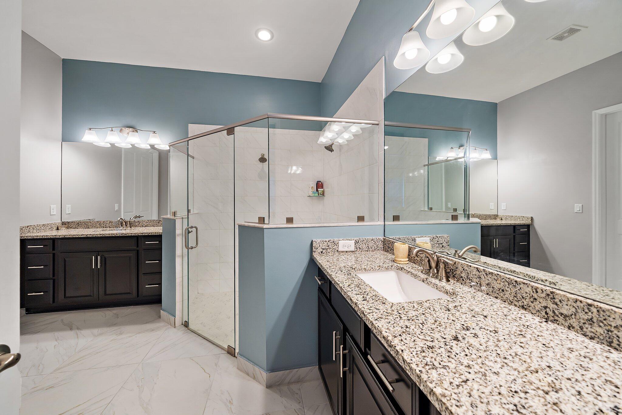 19540 Wheelbarrow Bend Loxahatchee, FL 33470 - Photo 29 of 54 a bathroom with a double vanity sink and a mirror