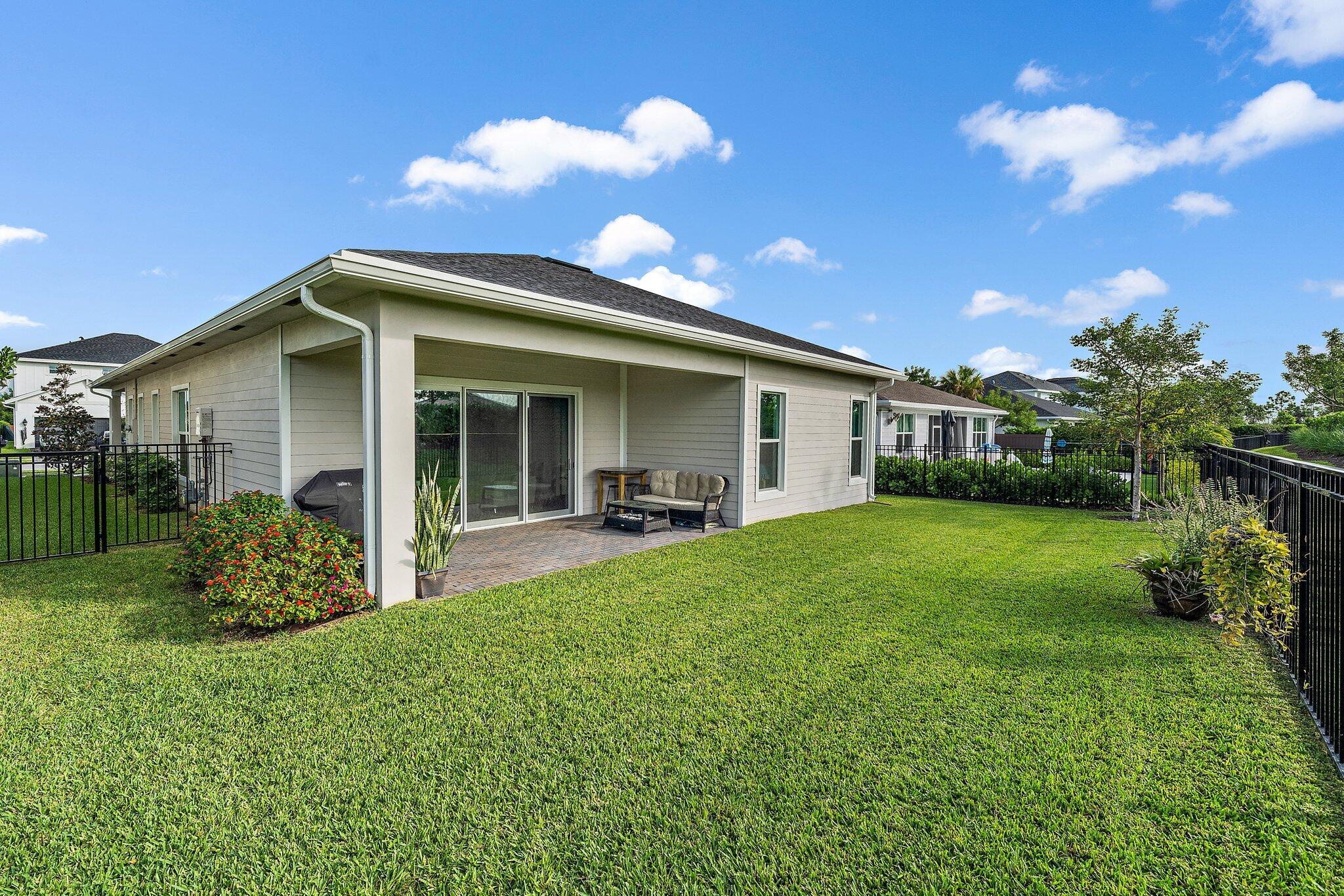 19540 Wheelbarrow Bend Loxahatchee, FL 33470 - Photo 36 of 54 a front view of house with a garden