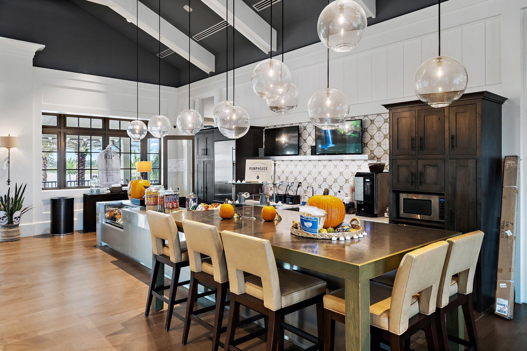 19540 Wheelbarrow Bend Loxahatchee, FL 33470 - Photo 39 of 54 a group of people sitting at tables in a room
